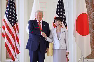 Japan's Prime Minister Sanae Takaichi (R) shakes hands with US President Donald Trump at the Akasaka State Guest House in Tokyo on October 28, 2025.