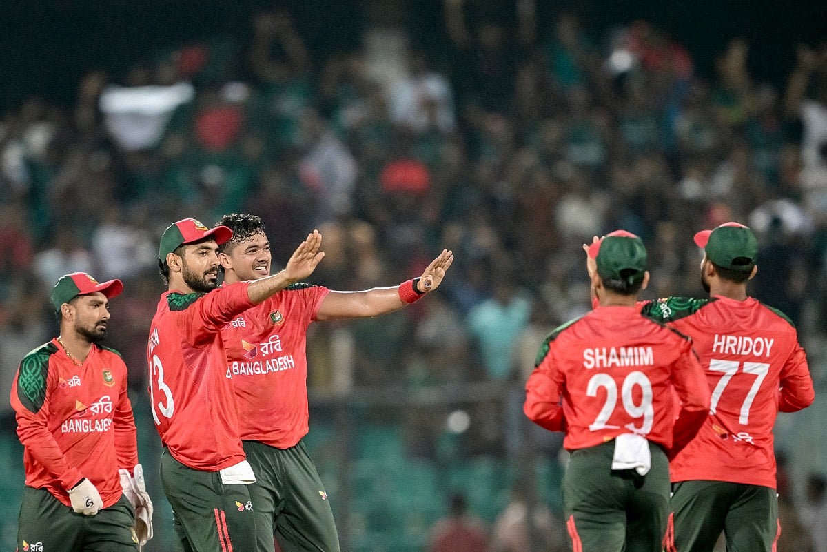 Bangladesh's Taskin Ahmed (3L) celebrates with teammates after taking the wicket of West Indies' Brandon King during the second Twenty20 international cricket match between Bangladesh and West Indies at the Bir Sreshtho Flight Lieutenant Matiur Rahman Stadium in Chittagong on October 29, 2025.