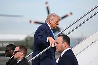 US President Donald Trump boards Air Force One before travelling to South Korea, at Haneda Airport in Tokyo on October 29, 2025.