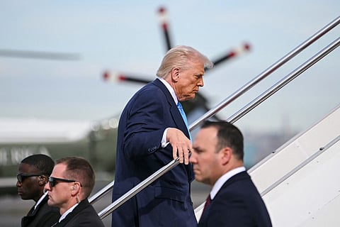 US President Donald Trump boards Air Force One before travelling to South Korea, at Haneda Airport in Tokyo on October 29, 2025.