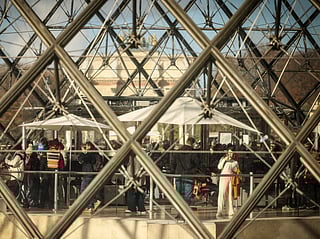 Visitors queue outside the Louvre museum, one week after the robbery, Sunday, Oct. 26, 2025 in Paris.  