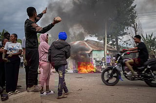 People protest in the streets of Arusha, Tanzania, on election day Wednesday, Oct. 29, 2025. 