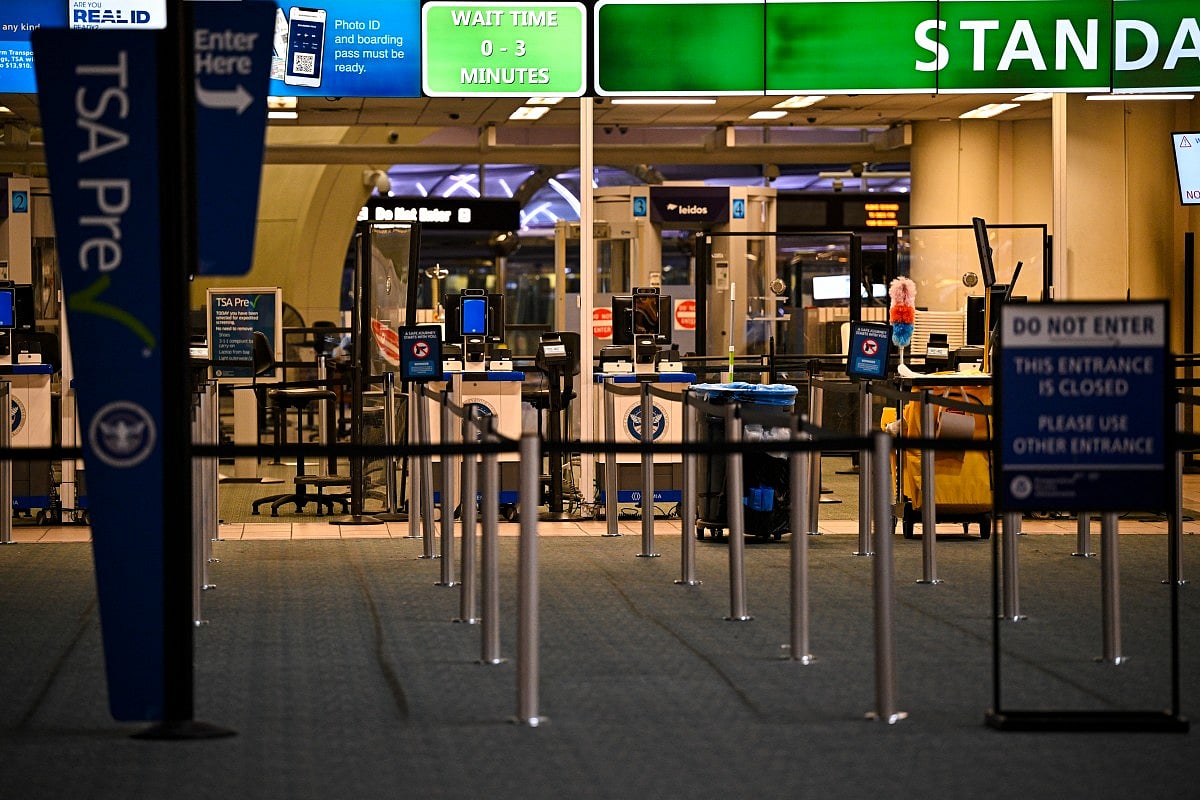 The TSA counter stands empty at Orlando International Airport in Orlando, Florida on October 30, 2025.