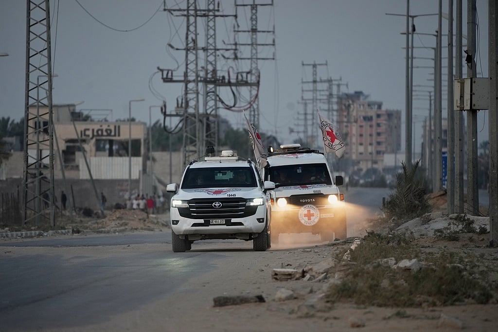 Red Cross vehicles carrying the bodies of two people believed to be deceased hostages handed over by Hamas make their way toward the Kissufim border crossing with Israel, to be transferred to Israeli authorities, in Deir al-Balah, central Gaza Strip, Thursday, Oct. 30, 2025. File photo