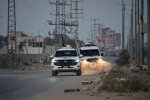 Red Cross vehicles carrying the bodies of two people believed to be deceased hostages handed over by Hamas make their way toward the Kissufim border crossing with Israel, to be transferred to Israeli authorities, in Deir al-Balah, central Gaza Strip, Thursday, Oct. 30, 2025. File photo