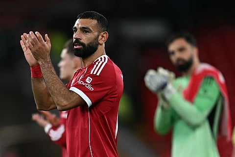 Liverpool's Egyptian striker #11 Mohamed Salah warms up for the English Premier League football match between Brentford and Liverpool at the Gtech Community Stadium in London on October 25, 2025.