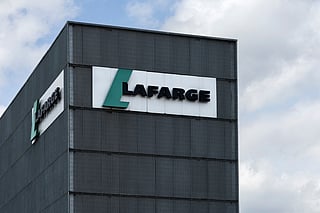 This photograph shows the logo of the French industrial company Lafarge displayed on a building of a cement plant in northern Paris, on April 14, 2025.