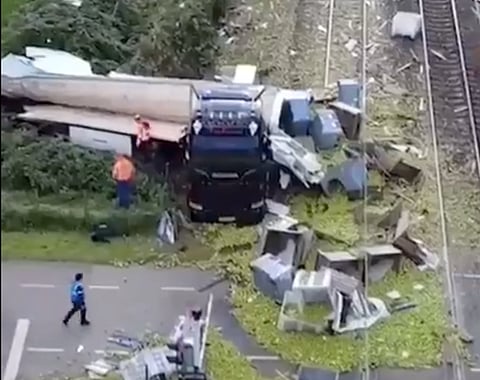 The cargo truck failed to clear the railway crossing in Meteren, central Netherlands, as the barriers descended abruptly. The trailer was violently severed by the impact of the oncoming high-speed train.