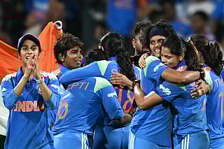India's players celebrate their win at the end of the ICC Women's Cricket World Cup 2025 one-day international (ODI) final match between India and South Africa at the DY Patil Stadium in Navi Mumbai on November 3, 2025.