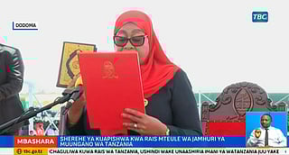 This video grab made from a video from the Tanzania Broadcasting Corporation (TBC) shows Samia Suluhu Hassan taking the oath of office during her inauguration ceremony in Dar es Salaam.