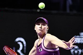 Kazakhstan's Elena Rybakina returns the ball to Poland's Iga Natalia Swiatek during their tennis match at the WTA Finals in Riyadh on November 3, 2025.