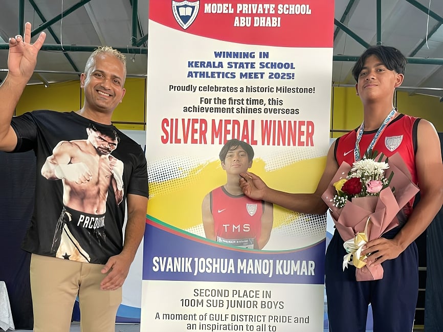 Svanik Joshua with his father, Manoj Kumar, after being felicitated at the school.