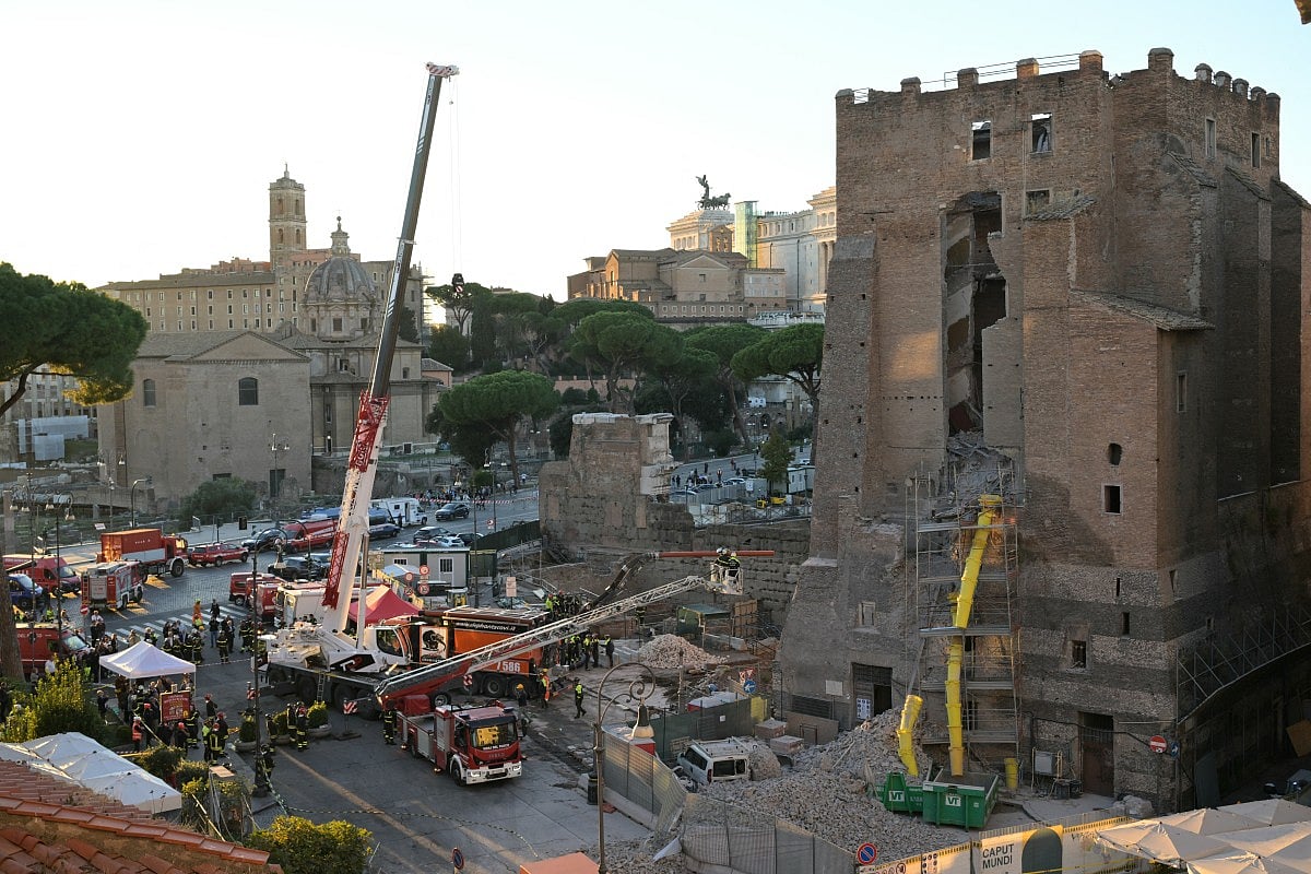 Firefighters work on the site after a part of medieval tower "Torre dei Conti" collapses near the Roman Forum in the historic center of Rome on November 3, 2025.