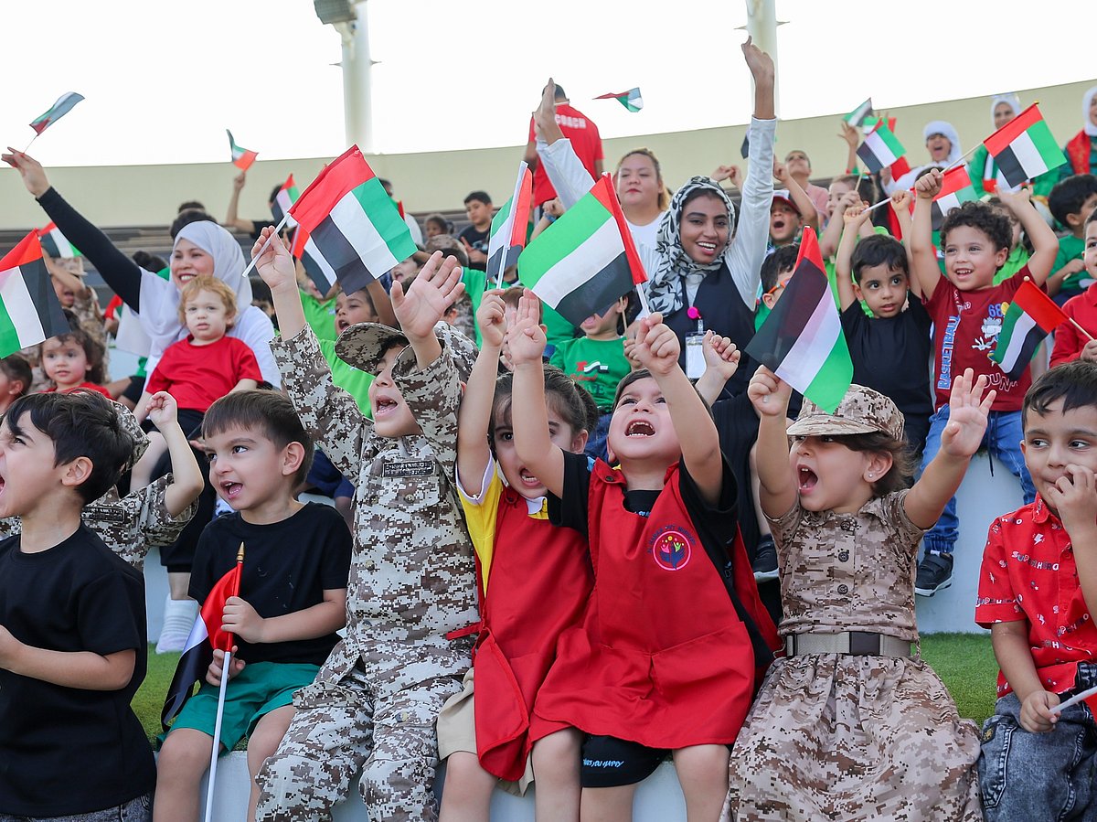 Students gather at Sharjah’s Flag Island to celebrate UAE Flag Day, waving the nation’s colours high in a spirited display of unity and pride. 