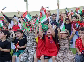 Students gather at Sharjah’s Flag Island to celebrate UAE Flag Day, waving the nation’s colours high in a spirited display of unity and pride. 