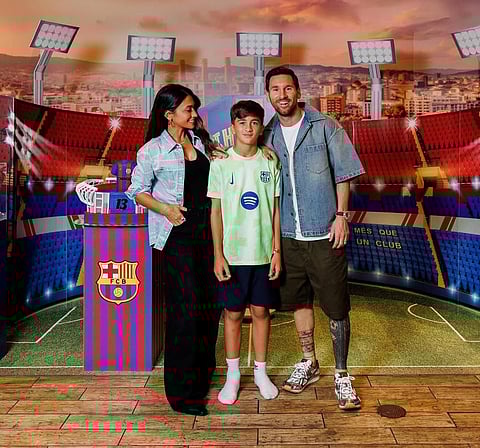 Thiago Messi celebrating his birthday with Messi in a Barca-themed background