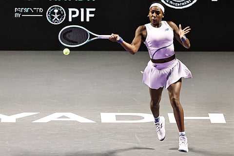 USA's Coco Gauff hits a return against Italy's Jasmine Paolini during their tennis match at the WTA Finals in Riyadh on November 4, 2025.