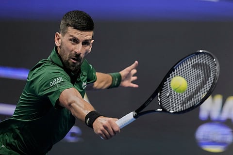 Novak Djokovic of Serbia plays a shot against Alejandro Tabilo of Chile during the ATP tournament round of 16 tennis match, in Athens, Greece, Tuesday, Nov. 4, 2025.