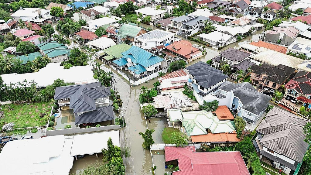 Residential areas are flooded by Typhoon Kalmaegi as it affects Cebu city, central Philippines, Tuesday Nov. 4, 2025.
