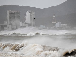 Waves crash onto Quy Nhon beach ahead of the arrival of Typhoon Kalmaegi in Gia Lai province in central Vietnam.