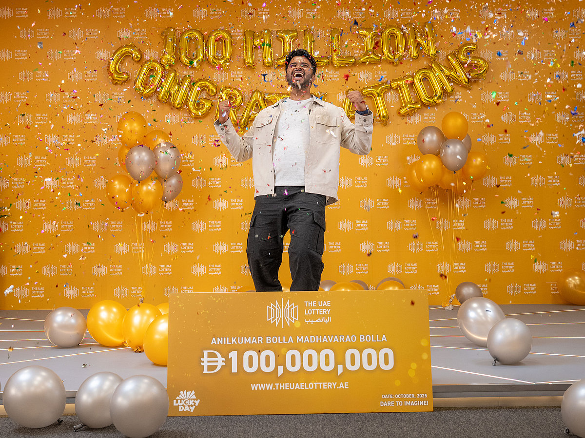 Anilkumar Bolla celebrating his historic win at The UAE Lottery's studio.