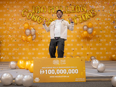 Anilkumar Bolla celebrating his historic win at The UAE Lottery's studio. 