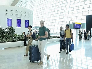 Passengers at the departures terminal at Abu Dhabi's Zayed International Airport.