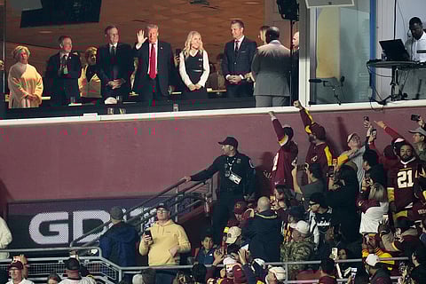 President Donald Trump is seen in a suite during the first half of an NFL football game between the Washington Commanders and the Detroit Lions Sunday, Nov. 9, 2025, in Landover, Md. (AP Photo/Stephanie Scarbrough)