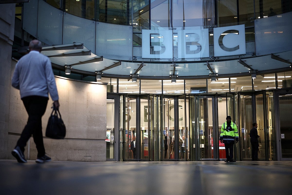 A man walks by the entrance to the BBC in London on November 10, 2025.