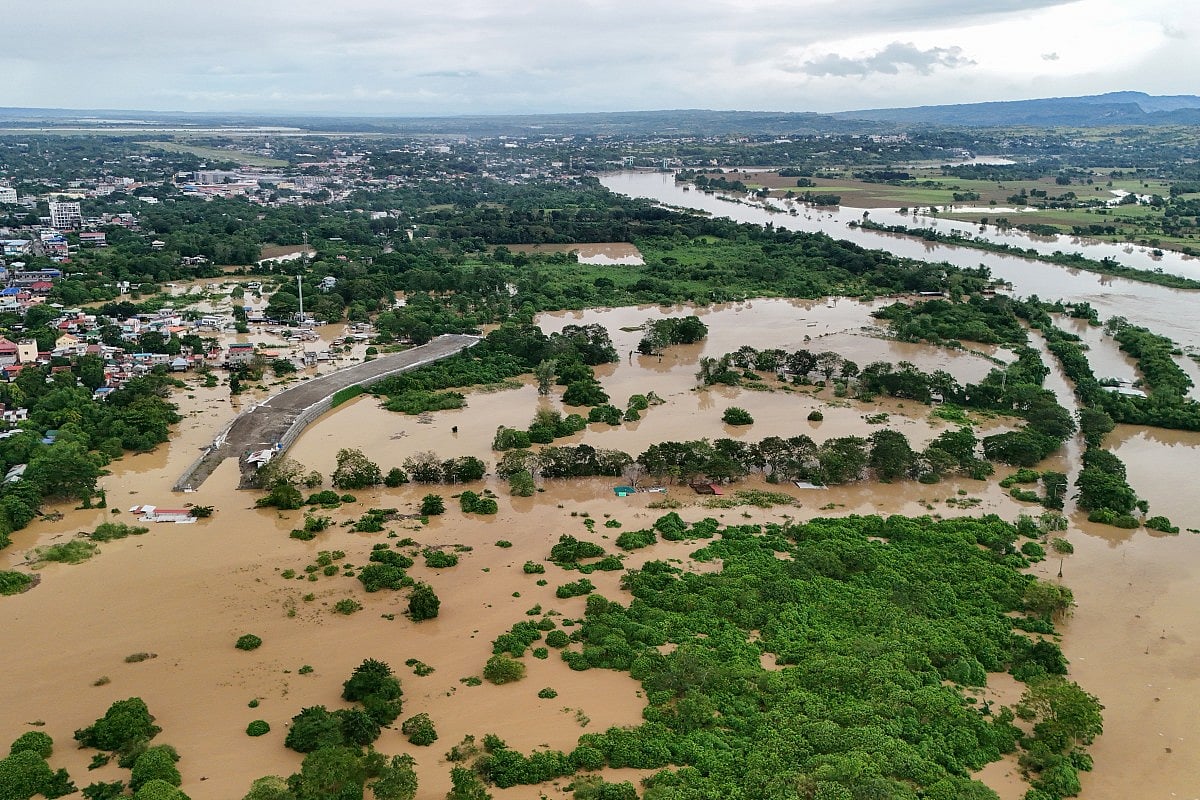 This photo shows an aerial view of flooded houses and rice fields in Tuguegarao City, Cagayan province, north of Manila on November 10, 2025, after a river overflowed following heavy rains brought about by Super Typhoon Fung-wong.