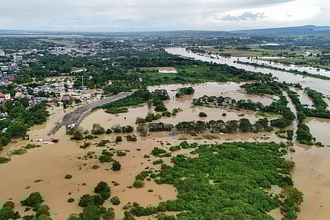 This photo shows an aerial view of flooded houses and rice fields in Tuguegarao City, Cagayan province, north of Manila on November 10, 2025, after a river overflowed following heavy rains brought about by Super Typhoon Fung-wong.