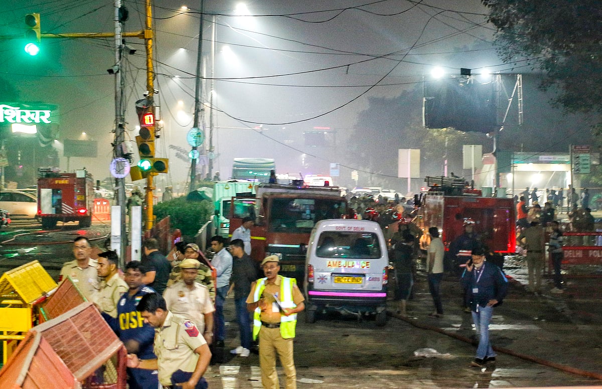 Delhi Police personnel at the site of a car blast near Gate No. 1 of the Red Fort Metro Station, in New Delhi, Monday, November 10, 2025.