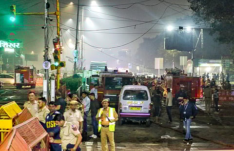 Delhi Police personnel at the site of a car blast near Gate No. 1 of the Red Fort Metro Station, in New Delhi, Monday, November 10, 2025.