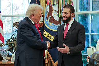 This handout photograph released by the official Syrian Arab News Agency (SANA) on November 10, 2025, shows US President Donald Trump (L) shaking hands with Syria's President Ahmed al-Sharaa at the White House in Washington DC.