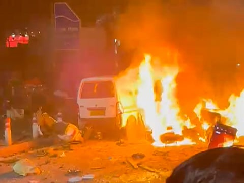 A car bursts into flames near Lal Quila Metro Station, close to Delhi’s Red Fort, after a blast-like sound. 
