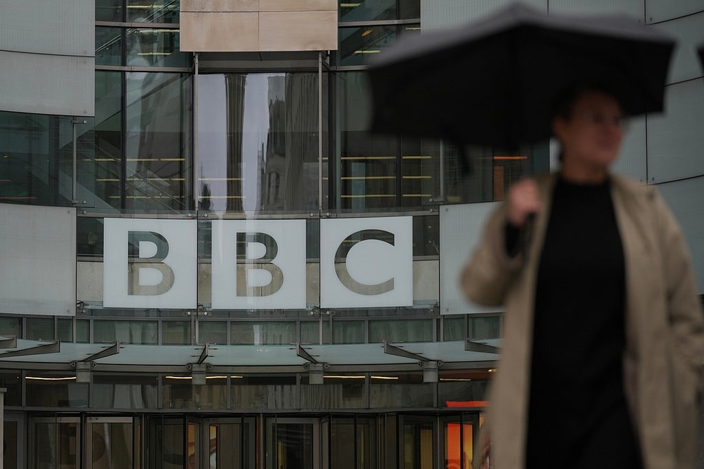 A man walks outside the BBC Headquarters in London, Monday, Nov. 10, 2025.