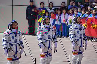 FILE - Chinese astronaut for the Shenzhou 20 mission, Chen Dong, center, speaks next to his comrades Chen Zhongrui, right, and Wang Jie as they attend a send-off ceremony for their manned space mission at the Jiuquan Satellite Launch Center in northwestern China, Thursday, April 24, 2025. (AP Photo/Andy Wong, file)