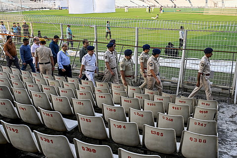 Police personnel inspect security arrangements at the Eden Gardens in Kolkata on November 11, 2025, ahead of the first Test cricket match between India and South Africa.