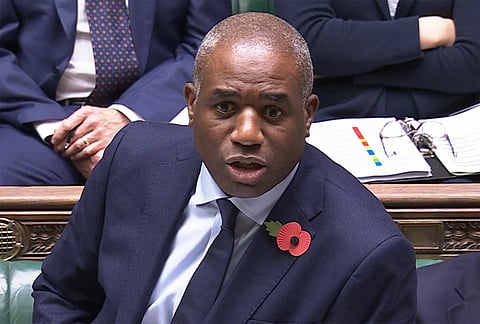 A video grab from footage broadcast by the UK Parliament's Parliamentary Recording Unit (PRU) shows Britain's Justice Secretary and deputy Prime Minister David Lammy as he makes a statement to MPs, after prisoners were accidentally released from prison, in the House of Commons in London, on November 11, 2025.