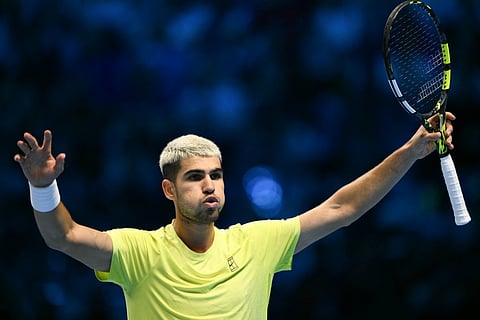 Spain's Carlos Alcaraz celebrate after winning the match against USA's Taylor Fritz during the ATP Finals tennis tournament in Turin on November 11, 2025.