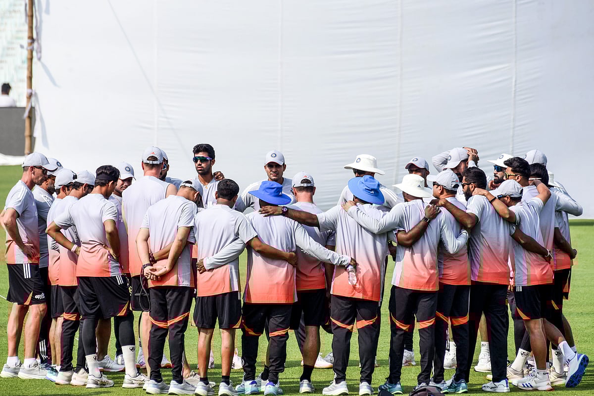 Indian team cuddle up after a training session in Kolkata.