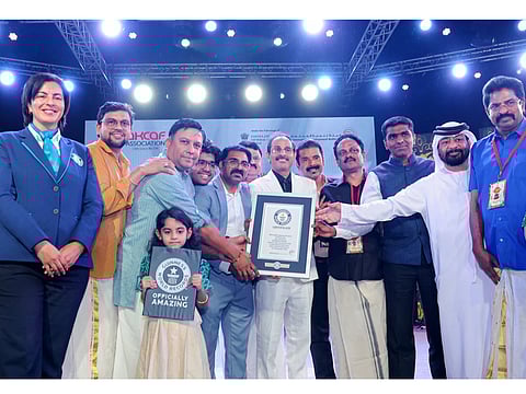 Vini International leaders, including Jagadeesh Manghat, Sales Director; Shaijan George, Business Head of the Realman Division and Rakesh Purohit, Sales Manager of Ossum, are receiving the Guinness World Record set by RealMan & Ossum by Vini International for Maximum People Applying Body Spray Simultaneously in Dubai on September 28. Also seen in the picture are the Event Coordinator Benny Thomas, Indian Consul General in Dubai Satish Kumar Sivan, AKCAF President Paul T Joseph, and other dignitaries