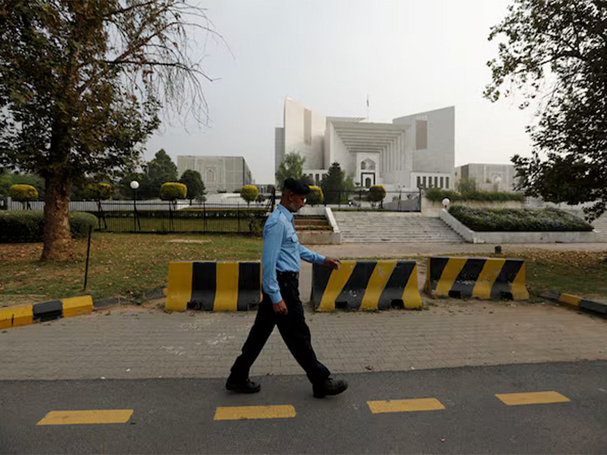 A policeman walks past the Supreme Court building in Islamabad, Pakistan. 