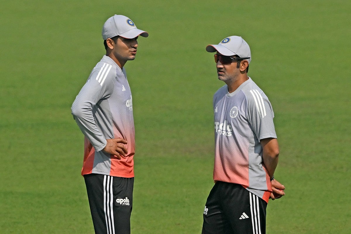 India’s captain Shubman Gill (L) and head coach Gautam Gambhir interact during a practice session on the eve of their first Test cricket match against South Africa, at the Eden Gardens in Kolkata on November 13, 2025.