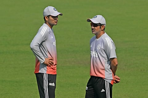 India’s captain Shubman Gill (L) and head coach Gautam Gambhir interact during a practice session on the eve of their first Test cricket match against South Africa, at the Eden Gardens in Kolkata on November 13, 2025.