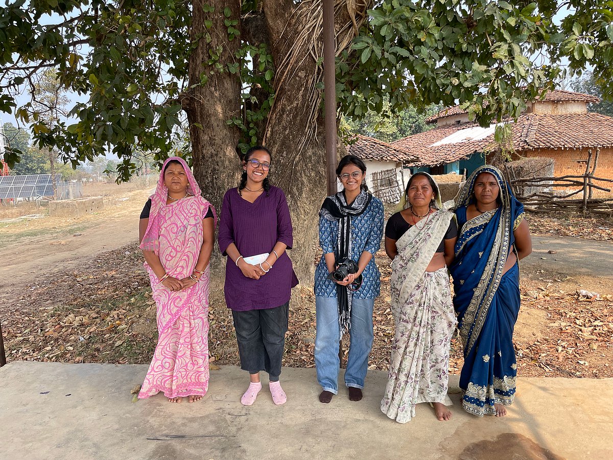 Niranjana Sunil and Arya Kulkarni with the tribal people