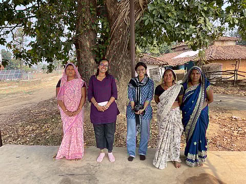 Niranjana Sunil and Arya Kulkarni with the tribal people