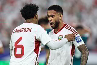 UAE's forward #20 Luan Pereira celebrates scoring his team's first goal with UAE's midfielder #6 Abdullah Ramadan during the FIFA World Cup 2026 Asian qualifier football match between the United Arab Emirates and Iraq at the Mohammed bin Zayed Stadium in Abu Dhabi on November 13, 2025.
