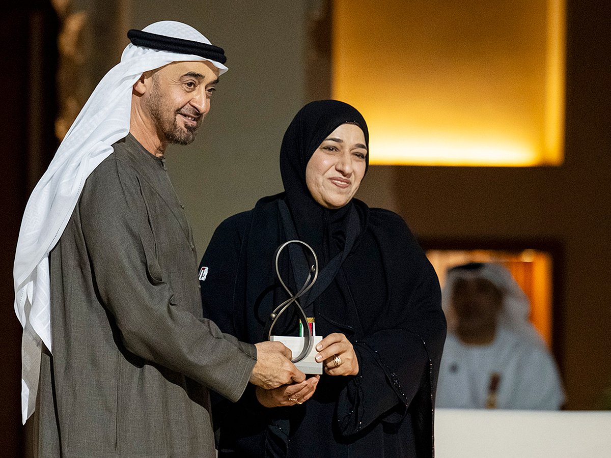 President His Highness Sheikh Mohamed bin Zayed Al Nahyan presents an award to Moza Mohamed Rashid Al Hafiti, during the Abu Dhabi Awards ceremony at Qasr Al Hosn.