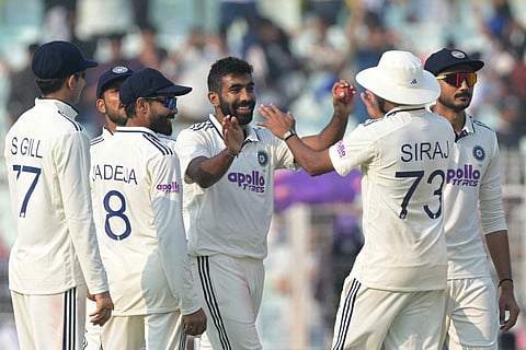 India's Jasprit Bumrah (C) celebrates after taking five-wicket haul during the first day of the first Test cricket match between India and South Africa at the Eden Gardens in Kolkata on November 14, 2025.
